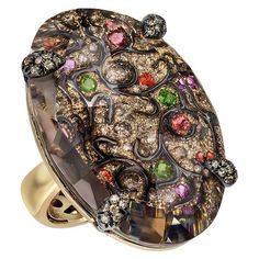 1.42 carats of round brown diamonds are precisely set with black enamel, tourmaline, amethysts and orange sapphires to create a beautiful arabesque design. This detailed piece is overlayed with a 39.70 carat brown quartz that magnifies the design and adds depth to the ring. Ring size 6.25, Can be sized upon request. Engagement Ring Nails, Tattoo Rings, Ring Nails, Rings Tattoo, Brown Diamonds, Ring Tattoos, Brown Jewelry, Chocolate Diamonds, Orange Sapphire