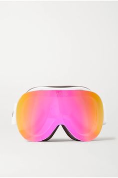 a pair of ski goggles sitting on top of a white surface