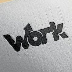 the word work written in black and white on a piece of paper that has been cut into