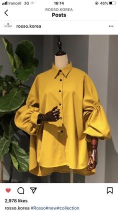 a mannequin wearing a yellow shirt and gloves