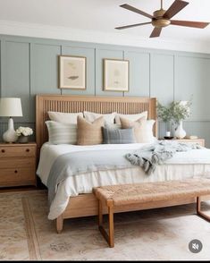 a bedroom with a bed, dressers and ceiling fan in the middle of it