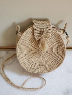 A handmade straw purse that will match any outfit for any event. Beige Braided Jute Straw Bag, Chic Handmade Jute Straw Bag, Beige Straw Bag With Weaving, Casual Natural Straw Bag With Weaving, Bohemian Woven Jute Straw Bag, Bohemian Straw Bag With Weaving Detail, Casual Straw Beach Bag With Weaving, Casual Straw Bag With Weaving For Beach, Summer Brown Straw Bag With Weaving