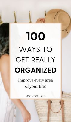 a woman standing in front of a wall with the words, 100 ways to get really organized improve every area of your life