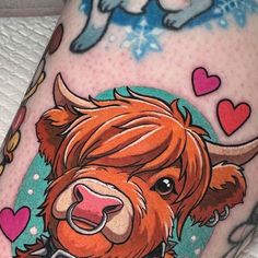 a close up of a person's leg with a tattoo on it and an image of a bull