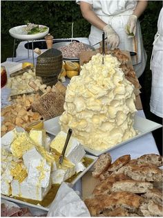 an assortment of desserts and pastries are on display for people to eat at