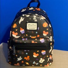 Disney Parks Loungefly Backpack Purse Disney-styled Black Standard Backpack, Black Disney Backpack For Halloween, Black Backpack For Theme Park, Disney Halloween Backpack For Disney Trips, Black Disney-style Bag For Theme Park, Black Disney Style Bag For Theme Park, Black Disney Backpack For Travel, Casual Black Backpack For Disney Trips, Black Disney Bag For Theme Park