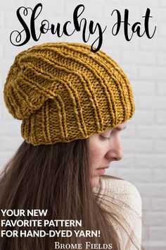 a woman wearing a knitted hat with the text, slouchy hat your new favorite pattern for hand - dyed yarns