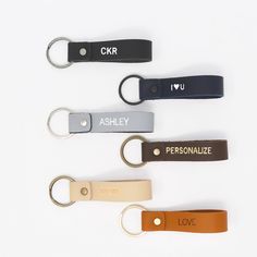 four personalized leather keychains in different colors