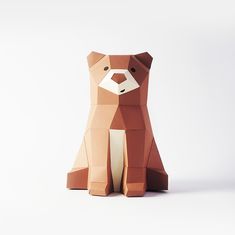 an origami bear sitting on its hind legs