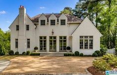 a large white house with lots of windows