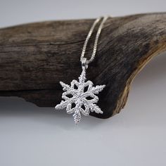 The incredible beauty and uniqueness of the snowflakes inspired me to create the snowflake series of jewelery. I tried to reflect the specialness of  their details to the jewellery, and make them wearable both for everyday use and special occasions. To make it even more authentic I used the same patterns on the backside of the designs. snowflake diameter 21mm   pendant height 26mm chain length  45 cm IMPORTANT NOTE: All shipments are sent with a tracking number. When you purchase, please don't f Sterling Silver Snowflake Jewelry For Winter, Silver Jewelry As Winter Gift, Sterling Silver Jewelry For Winter Gifts, Sterling Silver Necklaces For Winter Gifts, Silver Jewelry For Winter Gift, Sterling Silver Snowflake Jewelry, Silver Snowflake Necklace For Gift, Winter White Sterling Silver Necklaces, Elegant Sterling Silver Snowflake Jewelry