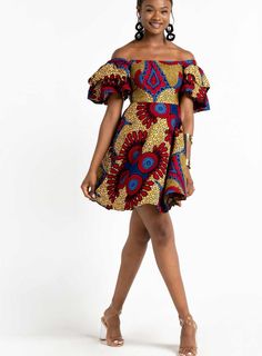 Trust the JUNIA African Print Mini Dress to keep you looking cute and chic at your next event! This eye-catching dress features some ruffled sleeves (2 layers), that can be worn on and off-the-shoulder. The lightweight cotton fabric ensures all-day comfort. This gorgeous dress is just perfect as a dress to wear to a wedding as a guest, casual hangouts, date nights, high-end formal events, or any of your special occasions. Style with flats for a flirty casual look or dress is up with heels for a African Traditional Dresses For Teenagers, Kitenge Designs For Young Ladies, Chitenge Dresses, Tailor Dress, Chitenge Outfits, Kitenge Designs, African Blouses, African Print Tops, Kindergarden Activities