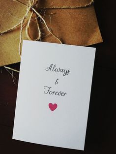 a card with the words always and forever written on it next to some twine