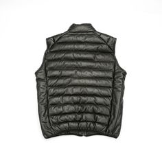 Keep warm all season long. For everyday wear and cold-weather warmth, our ribbed leather puffer vest is crafted from the finest materials. With a classic design and quality crafted for insulation, the Lucchese men’s puffer vest will last generations. Note: Fits small - recommend ordering a size up - Clean professionally Black Puffer Vest Leather, Puffy Vest Leather, Luxury Black Down Vest, Mens Puffer Vest Hoodie, Leather Puffer Vest, Leather Puffer, Handcrafted Boots, Handmade Boot, Puffer Vest