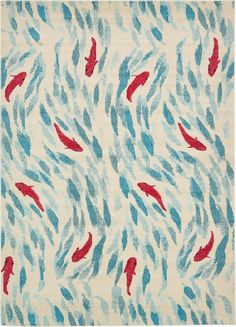 an area rug with red and blue fish in the water on top of white ground