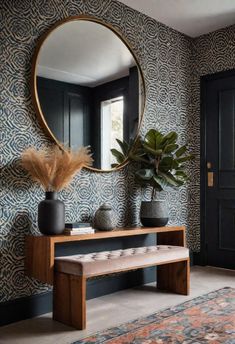 a room with a bench, mirror and potted plant on the side table in front of it