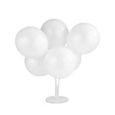 a bunch of white balloons sitting on top of a table