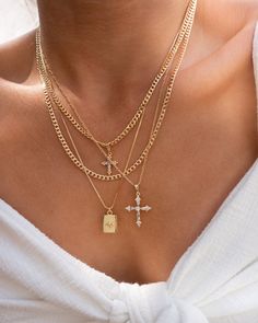 Dainty zirconia cross pendant in a figaro gold filled chain. Dimensions Pendant is 27 mm Chain is 20'' Materials Pendant is 18k gold filled over brass and cubic zirconia and chain is 18k gold filled. *Hypoallergenic *Nickel free Notes ~ Soft jewelry pouch included. ~ Limit contact with water for longer durability and prevent tarnishing ~ Avoid contact with household chemicals like perfume, sprays, lotions, sunscreen and hair products. ~ Store your jewelry separately from other jewelry when not i Necklace Combos, Maria Necklace, Necklace Stacking, Soft Jewelry, Starburst Pendant, Jewelry Aesthetic, Chunky Chain Necklaces, Necklace Layering