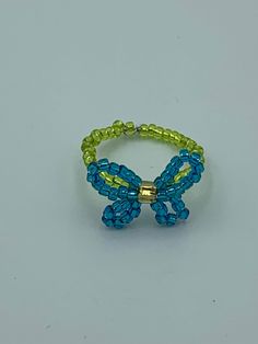 A beaded butterfly ring. Can be worn alone or stacked. Looks cute on any finger. Beaded Butterfly Ring, Seed Bead Butterfly, Bead Butterfly, Beaded Butterfly, Butterfly Ring, Beaded Rings, Kids Activities, Stackable Rings, Seed Bead