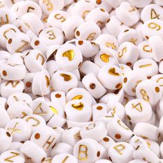 white and gold ear plugs with numbers on them