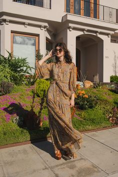 This paisley chiffon maxi dress is sophisticated yet effortless with its high collar, button-up design paired with bishop sleeves, tiered skirt, and a slim matching sash. Crafted with a soft, airy fabric that drapes beautifully to create a sophisticated silhouette, this piece is a timeless addition to any wardrobe. Machine wash cold, gentle cycle, and hang dry. Sizing:X-Small 0-2Small 4-6Medium 8-10Large 12-14X-Large 16-18 Kaftan Designs, Fabulous Dresses, Chiffon Maxi, Chiffon Maxi Dress, Kaftan Dress, Tier Skirt, Tiered Skirt, Dress Clothes For Women, High Collar