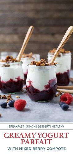 three desserts in small jars with berries and granola on the side, topped with yogurt