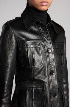 The wardrobe-essential field jacket is reinterpreted in Tom Ford's glamorous vision in this richly grained leather version refreshed with a glossy finish and softly cropped sleeves. Front button closure Spread collar Bracelet-length sleeves with button cuffs Front patch pockets Leather Made in Italy Designer Clothing Leather Outerwear With Flap Pockets, Luxury Black Leather Jacket With Flap Pockets, Luxury Leather Jacket With Flap Pockets, Luxury Leather Jacket With Pockets For Work, Fitted Luxury Leather Jacket With Pockets, Luxury Fitted Leather Jacket With Pockets, Leather Business Outerwear With Patch Pockets, Luxury Leather Outerwear With Pockets, Elegant Fitted Leather Jacket With Flap Pockets