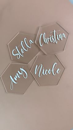 three glass coasters with the words hello, christmas and nice written on them