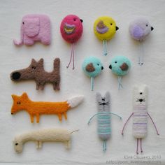 there are many different types of felt animals on the table