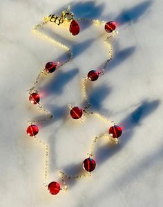 Gorgeous, glowing, deep red, faceted  garnets are simply wire wrapped and interspersed on a delicate gold chain.   So pretty and easy to wear!   14k Yellow Gold-filled Red Garnet Necklace, Delicate Gold Chain, Garnet Necklace, Valentines Necklace, Red Garnet, Deep Red, Pendant Necklaces, Gold Chain, Wire Wrapped