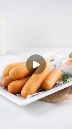 carrot sticks on a plate with dipping sauce