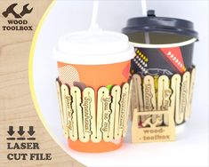 two paper cups with lids and straws on them