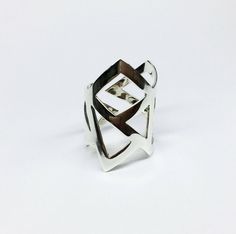 This is a handmade sterling silver geometry ring made from a silver sheet 0,8mm width. This ring is really unique and it can be worn in 2 different ways.Even though it is adjustable I need your ring size in order to have a perfect fit.This ring can be in matt or shinny finish. MATERIALS:sterling silver 925 DIMENSION:3 cm maximum height(1 1/4 in.) Also available in 24K gold plated bronze: https://www.etsy.com/listing/118664304/gold-ring-24k-gold-plated-bronze-ring I can make this ring to your siz Contemporary Jewelry Rings, Architectural Rings, Contemporary Jewellery Necklace, Gold Minimalist Ring, Mixed Metal Rings, Triangle Ring, Gold Statement Ring, Bronze Ring, Contemporary Ring