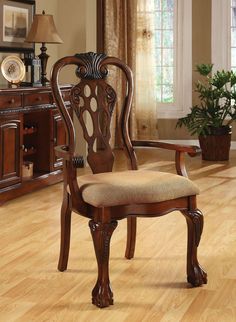 a wooden chair sitting on top of a hard wood floor