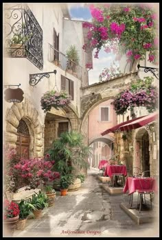 an alleyway with tables and chairs covered in pink flowered hanging baskets filled with flowers