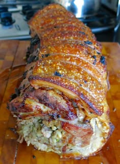 a large meatloaf is sitting on a cutting board