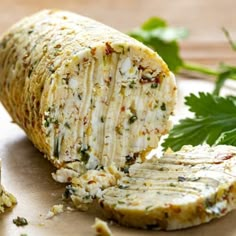 some kind of food that is cut in half and sitting on a cutting board next to parsley