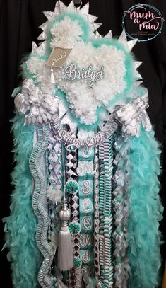 a blue and white feathered dress with the word bridal on it's chest