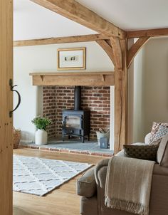 a living room filled with furniture and a fire place