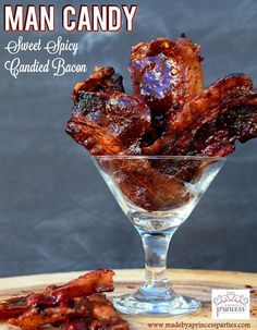 sweet sticky candied bacon in a small glass bowl on a wooden board with the words sweet sticky candied bacon written above it