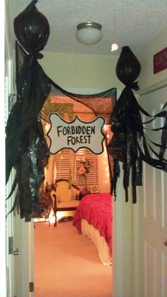 the entrance to forbidden forest is decorated for halloween