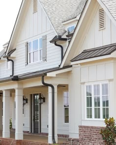 a white house with black trim and windows