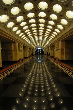 the inside of a building with many lights