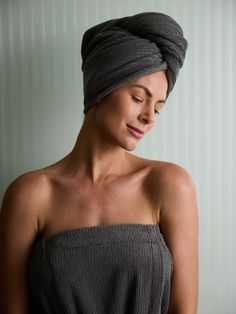 a woman with a towel wrapped around her head