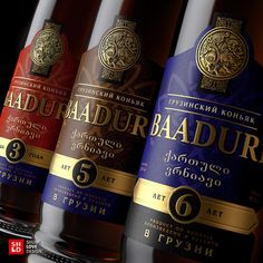 three bottles of baadur are lined up on a shelf in front of each other