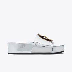 Our Patos slide is one of the most comfortable shoes we've ever made. Molded foam insole. Soft, metallic leather lining. A chic flatform finished with mismatched metal discs, evocative of ’60s glamour. Sporty and polished, it looks great dressed up or down. Modern Open Toe Platform Slippers With Textured Footbed, Modern Platform Slip-on Slides, Modern Platform Slide Slippers With Cushioned Footbed, Modern Cushioned Platform Slide Slippers, Modern Slip-on Slides, Modern Platform Slides With Open Toe, Modern Open Toe Platform Slides, Modern Slides With Leather Footbed, Silver Slides With Removable Insole