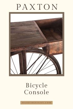 the cover of bicycle console by patton, featuring an old wooden table and wheel