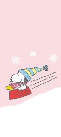 a cartoon dog laying on top of a red blanket with snowflakes in the background