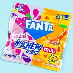 an unopened package of fanta candy on a blue background