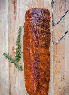 a large piece of meat sitting on top of a wooden cutting board